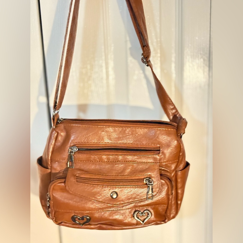 Ladies medium brown leather her. Very soft, never used.